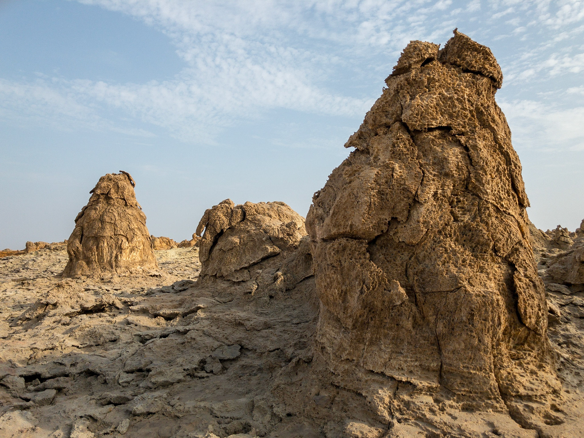 Great mounds of brown, dried salt erupt from the Asale salt pan in Ethiopia’s Danakil Depression, the hottest, driest, most inhospitable place on Earth.