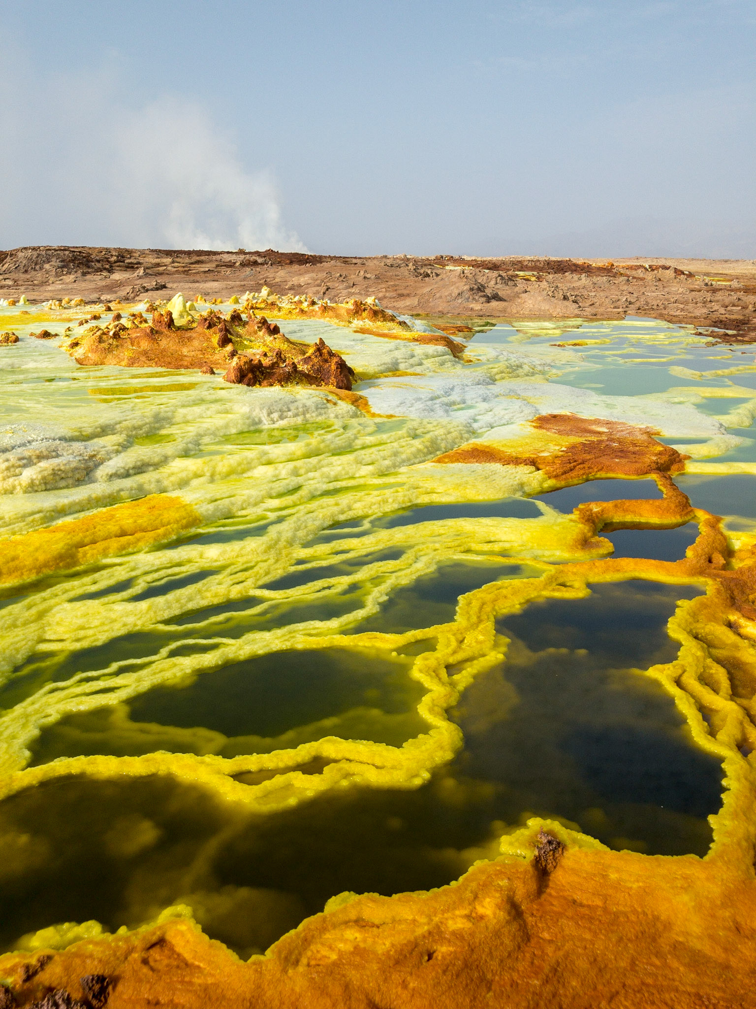 Green, orange and yellow pools of saline, sulphuric acid, formed from hydrogen thermal activity at Dallol in Ethiopia’s Danakil Depression, the most inhospitable place on Earth.