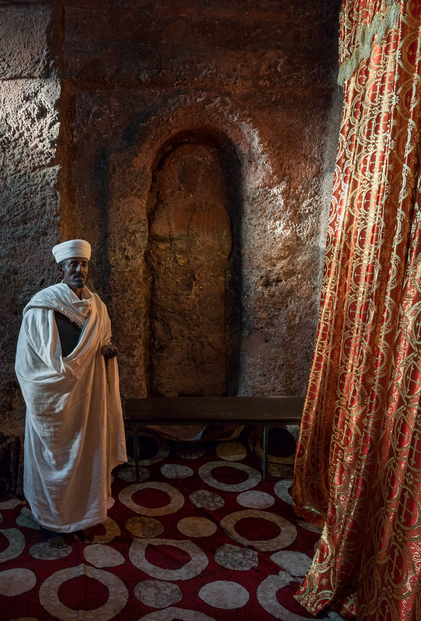 Priest and Effigy, Biete Golgotha, Lalibela, Ethiopia
