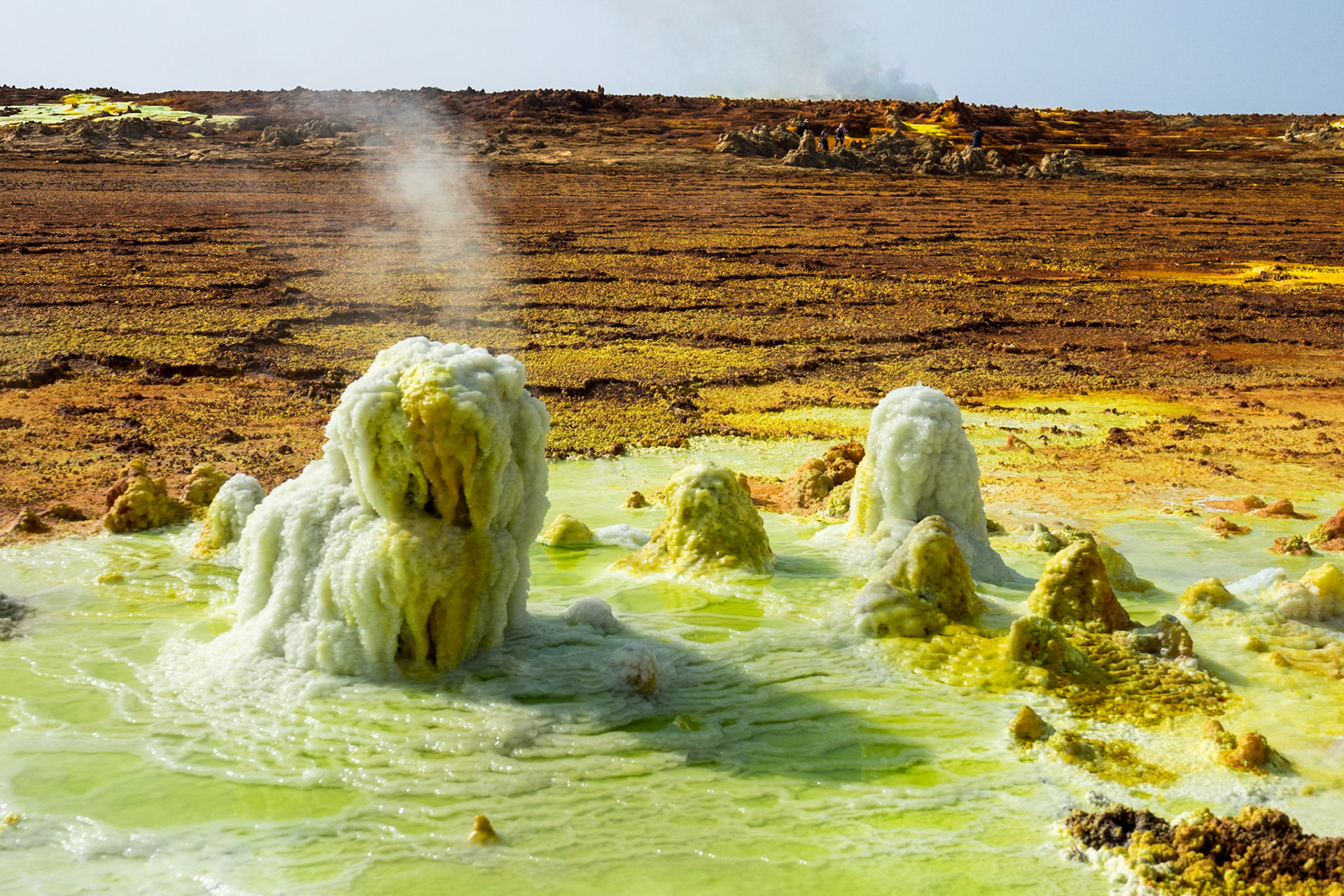 Fumaroles spouting sulphuric acid and gas erupt on the floor of Dallol in Ethiopia’s Danakil Depression, creating yellow and green pools and orange-brown geometric patterns, in the hottest, driest, most inhospitable place on Earth.