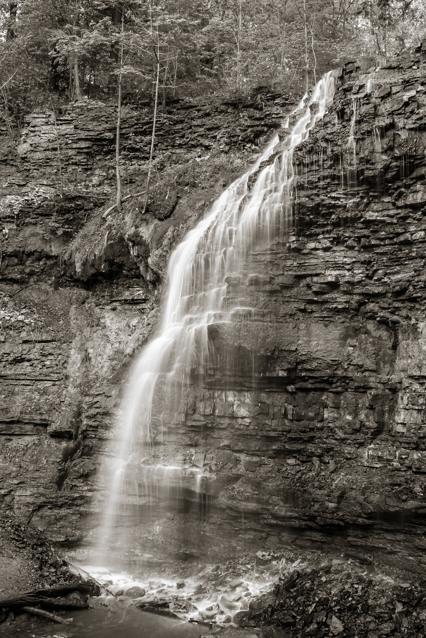 The bridal veil of Tiffany Falls tumbles over the sedimentary rock along the Bruce Trail on the Niagara Escarpment, a UNESCO World Biosphere Reserve, Hamilton, Ontario, Canada