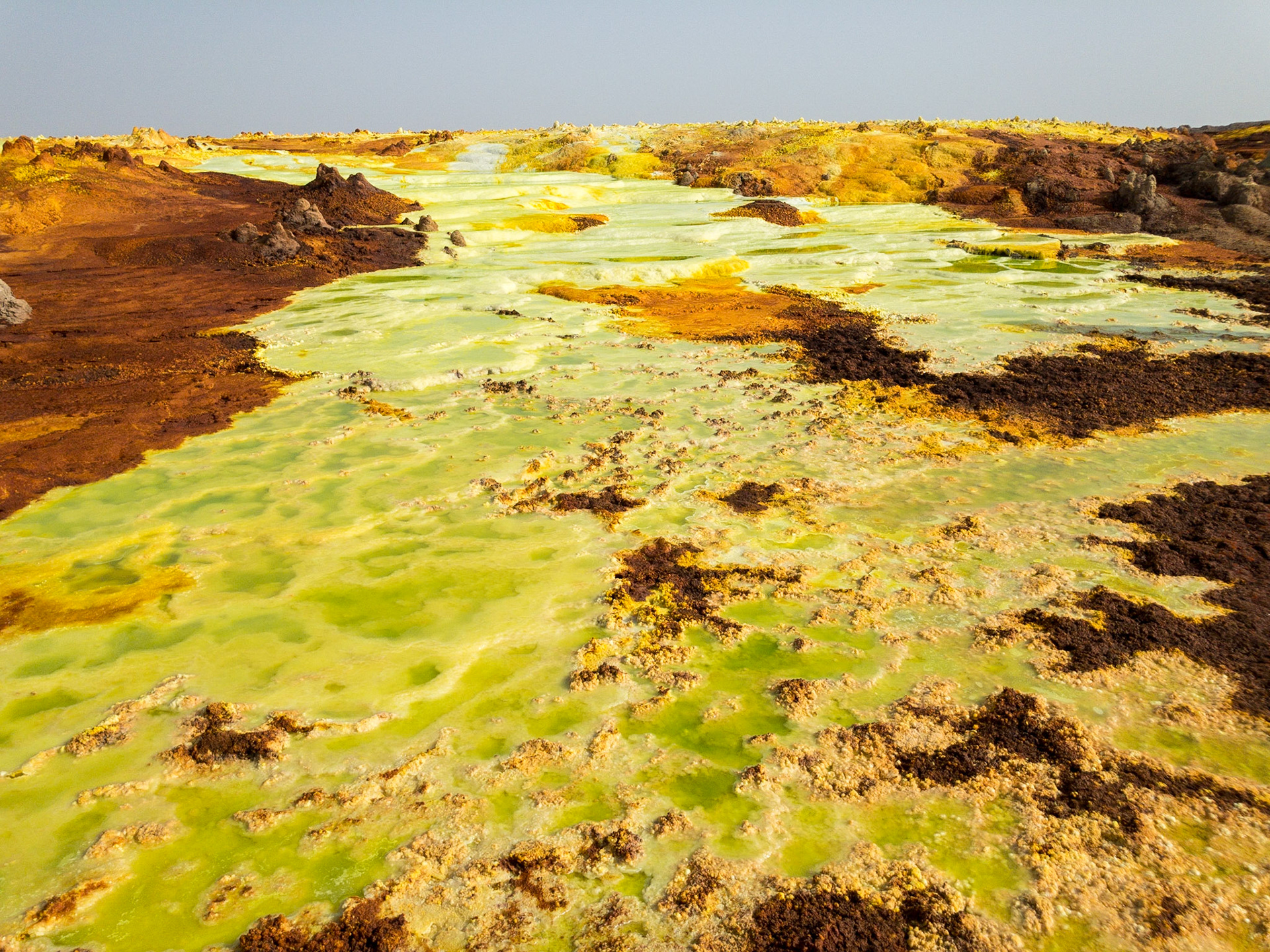 Green, orange and yellow pools of saline, sulphuric acid, formed from hydrogen thermal activity at Dallol in Ethiopia’s Danakil Depression, the most inhospitable place on Earth.