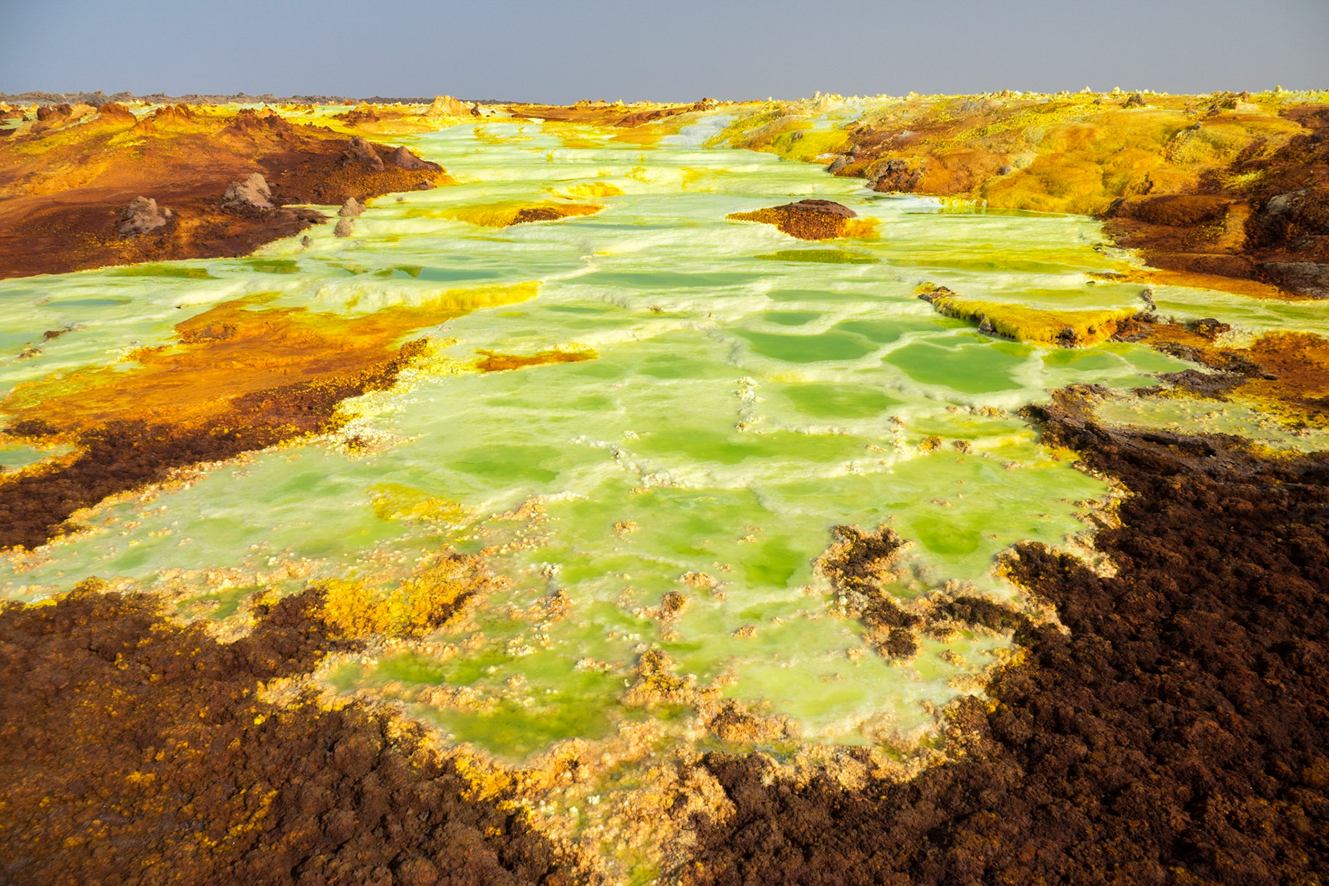 Green, orange and yellow pools of saline, sulphuric acid, formed from hydrogen thermal activity at Dallol in Ethiopia’s Danakil Depression, the most inhospitable place on Earth.