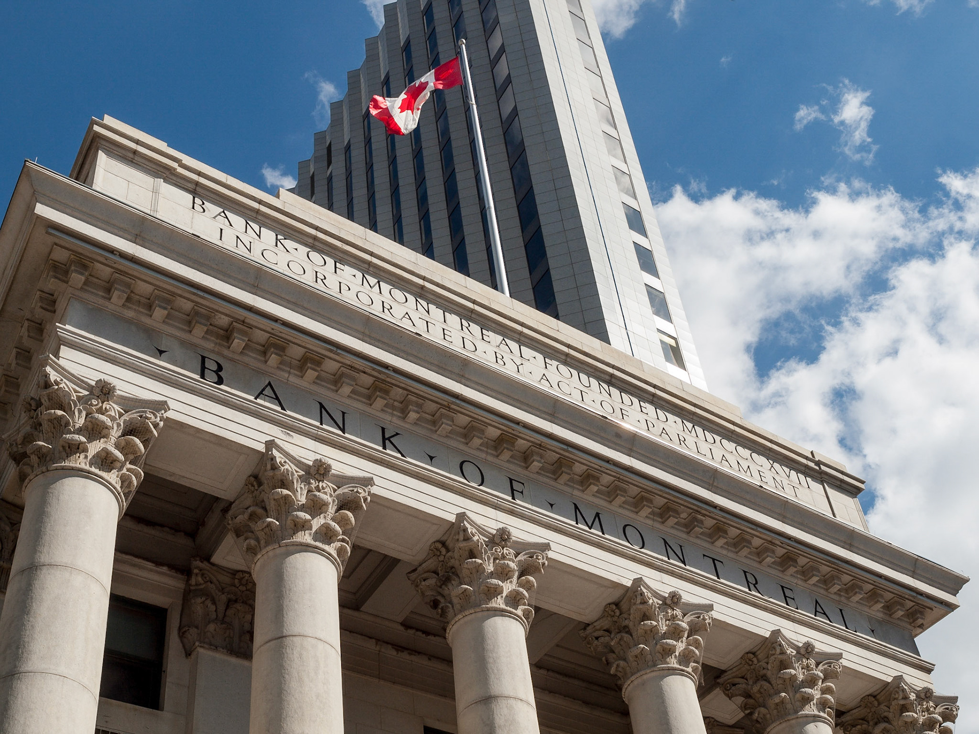 Bank of Montreal Building and Canadian flag at Portage &amp; Main, Winnipeg, Manitoba, Canada