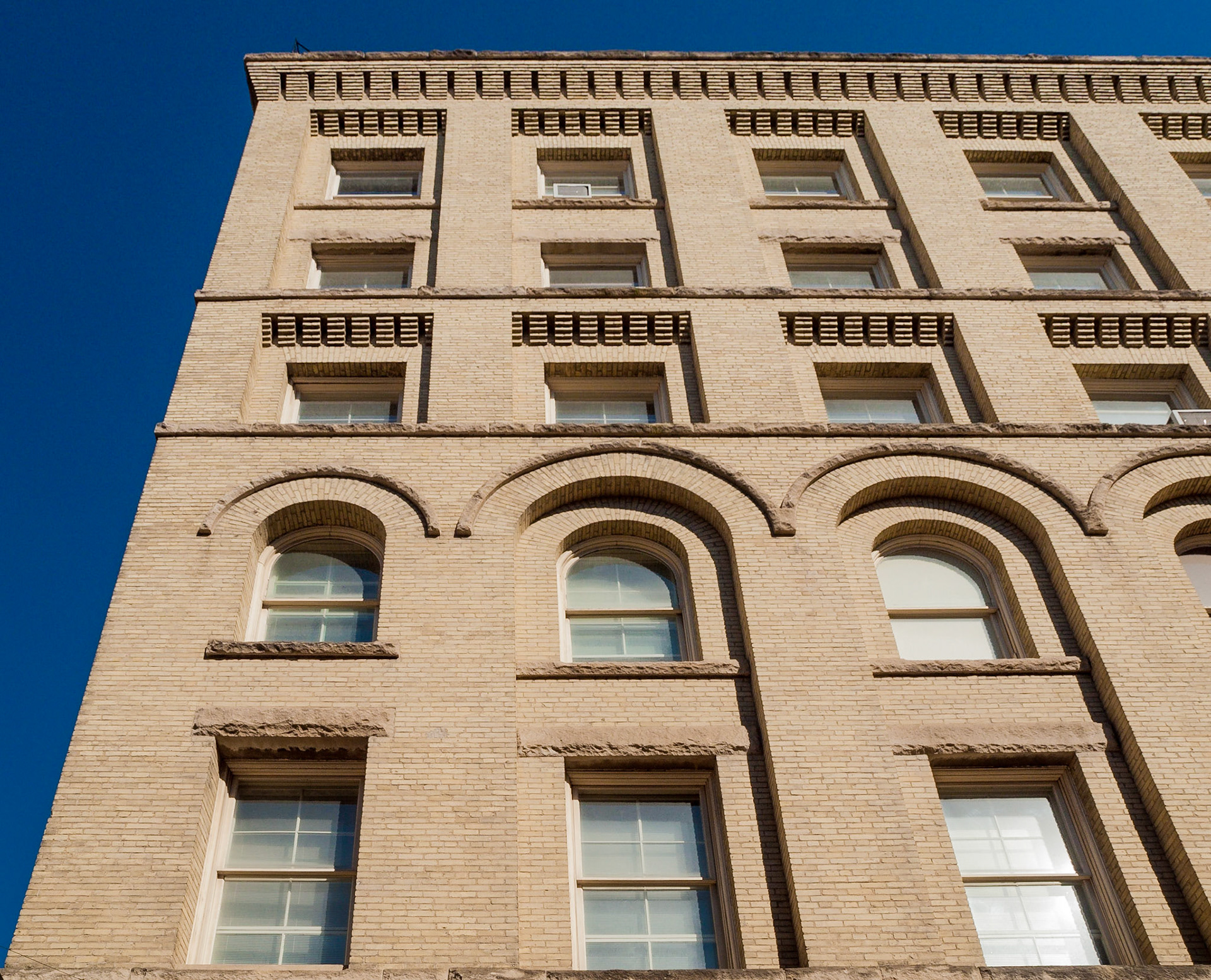 Yellow brick building and ornate windows, The Exchange District, Winnipeg, Manitoba, Canada
