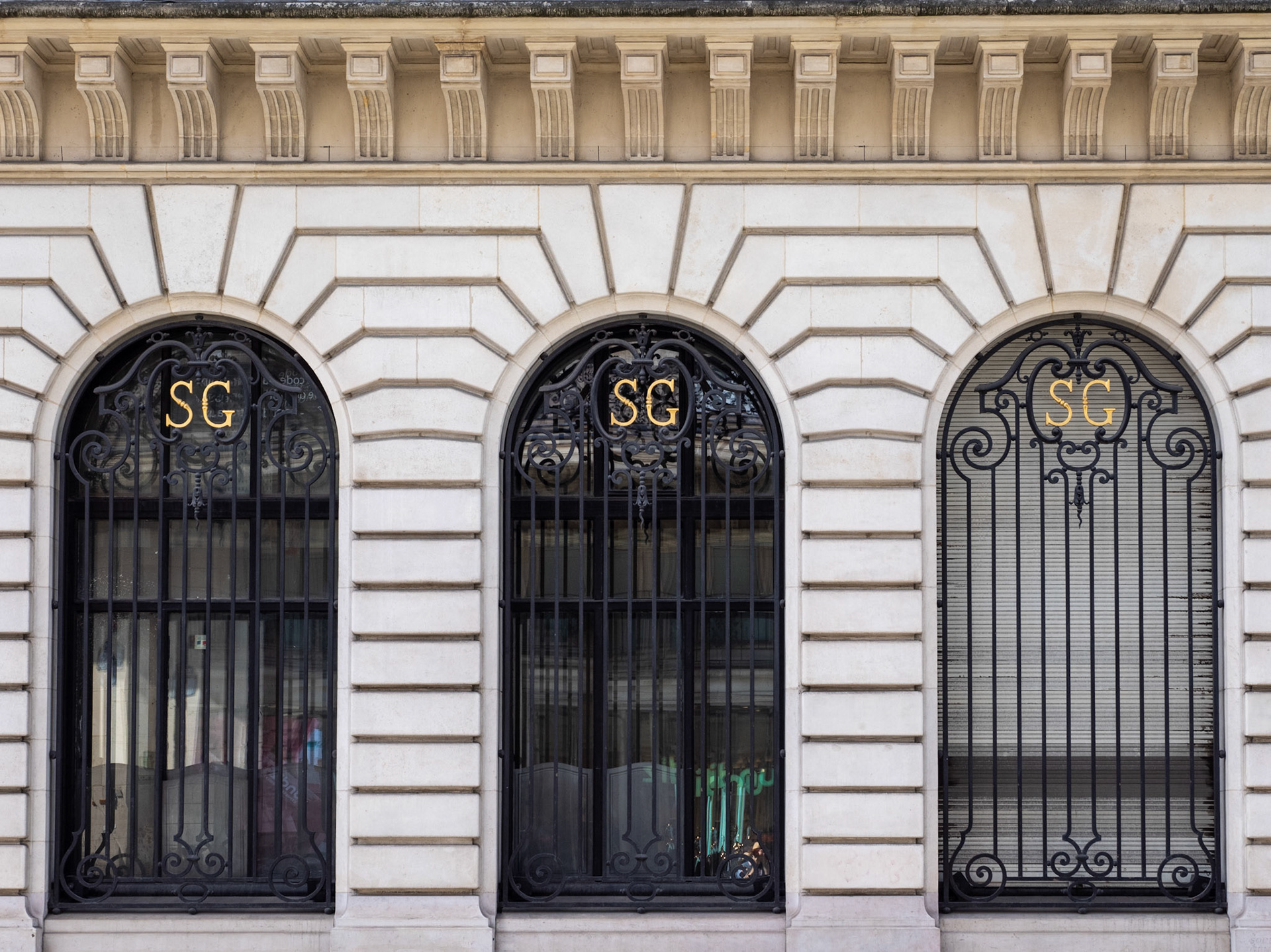 Design and pattern details of the arched windows and window grates of the Société Générale building, Paris