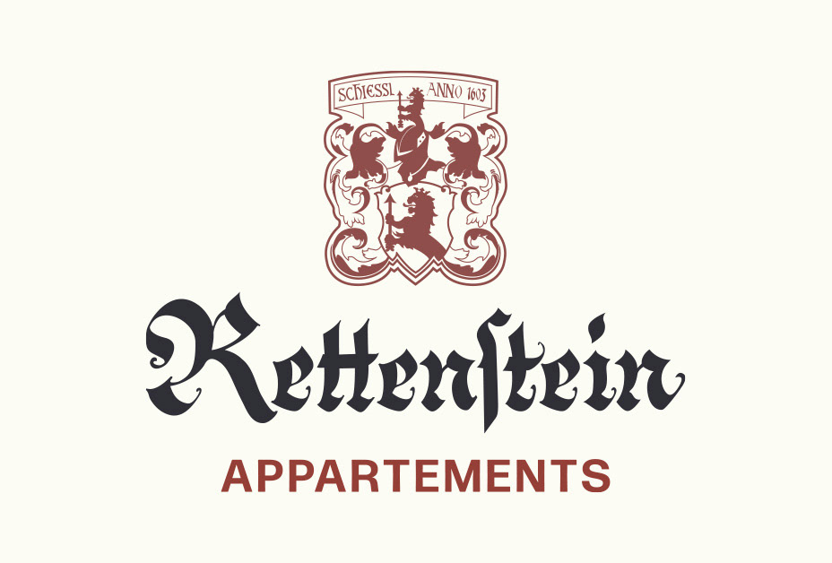 Logo: Wort-Bild-Marke mit Wappen von Appartements Rettenstein in tiefem Grau und edlem Braun-Rot.