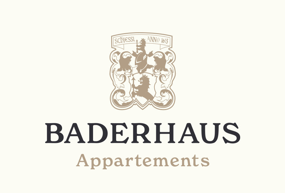 Logo: Wort-Bild-Marke mit Wappen von Appartements Baderhaus in tiefem Grau und edlem Gold.