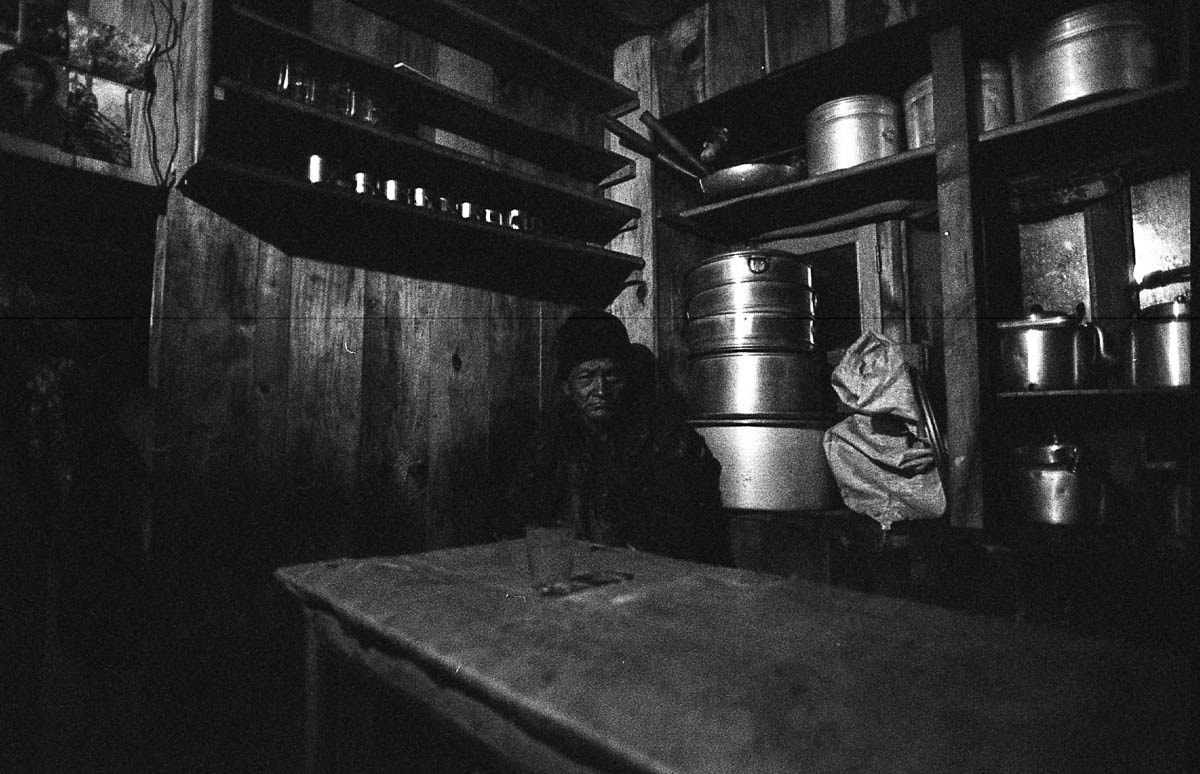 The village bar attracts people who come to enjoy drinks and watch TV, which they may not have access to at home.