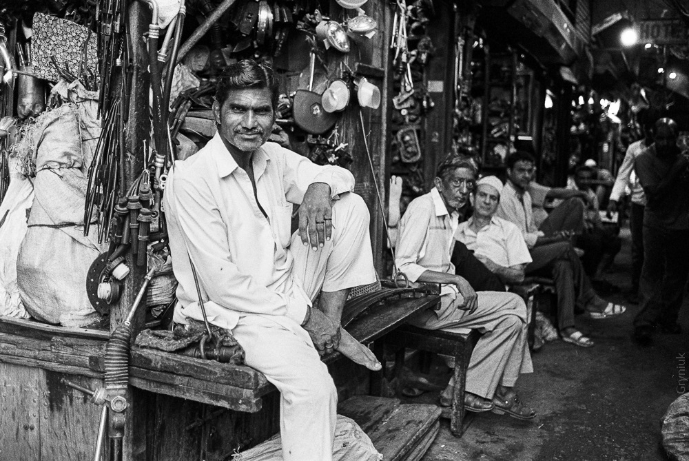 A merchant selling various secondhand tools at the Delhi Hardware Market.