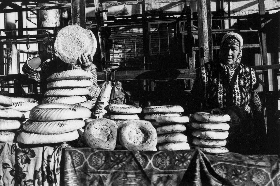 The taste of Kyrgyz culture - traditional bread, freshly baked, at a bustling street market in Osh.