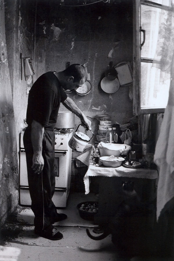 The worn-out balcony of Vagan, a 40-year-old taxi driver, we catch a glimpse of the daily life that unfolds in his cramped home - where his family shares two rooms with a flock of chicken.