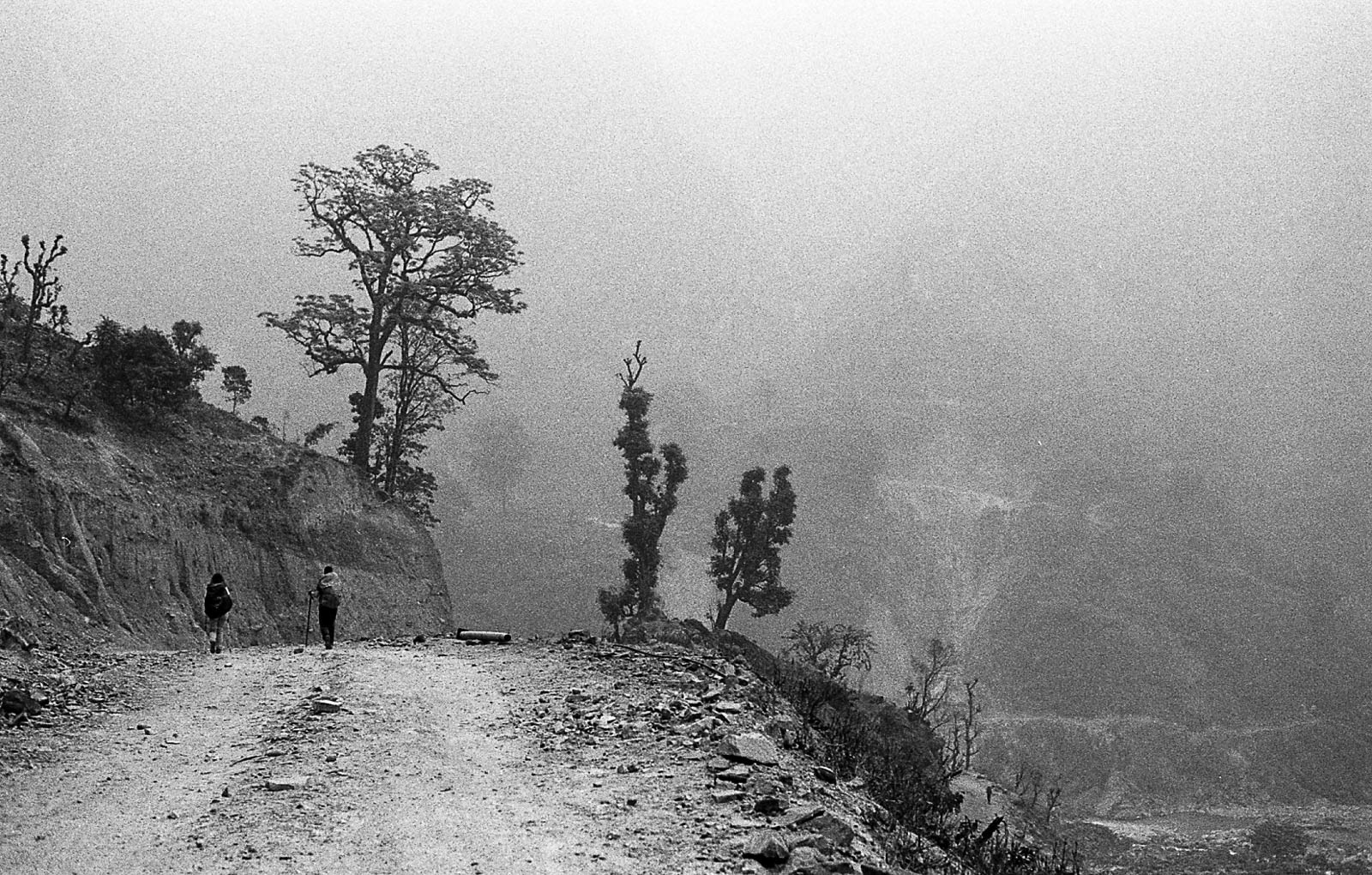 In the Himalayas, the arrival of spring is accompanied by a characteristic haze, which blankets the landscape in a soft, diffused light. 