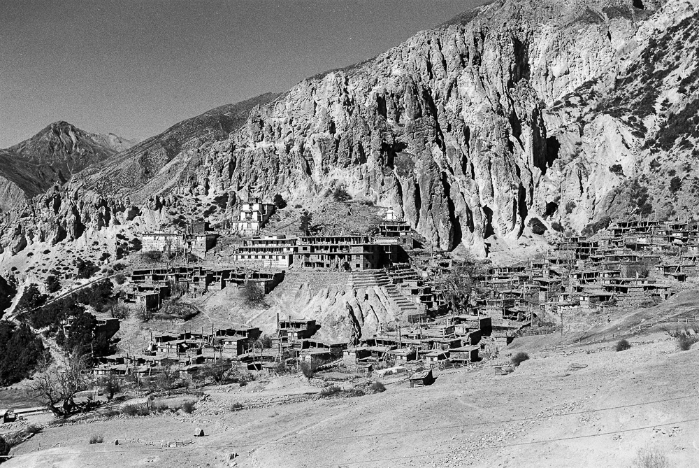 A panoramic view of the traditional Tibetan village of Braha in the Annapurna circle trek, where ancient architecture transport visitors to another era.