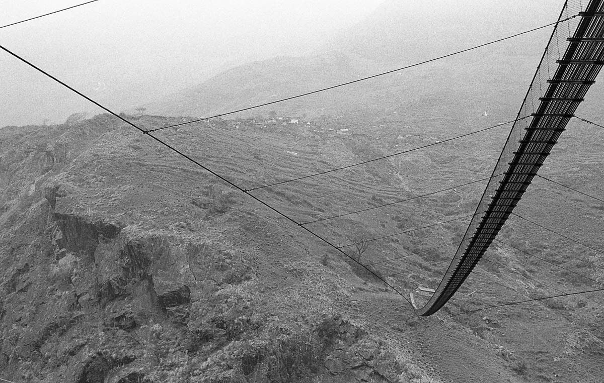 The suspension bridge, symbol of fast development, connects villages that were previously isolated, reducing the travel time between them from hours to minutes.
