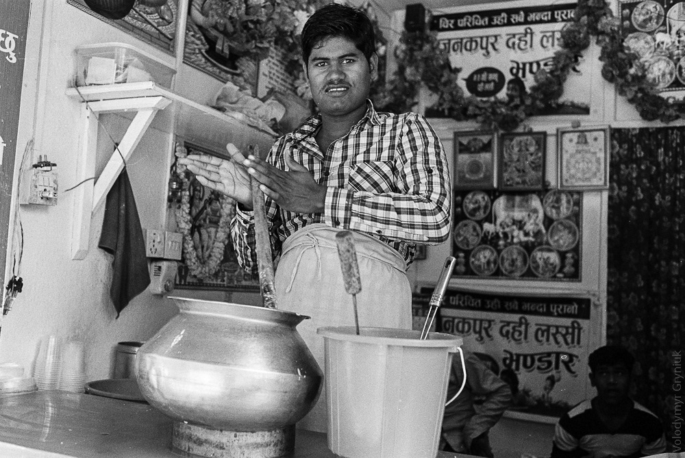 Vendor serves up lassi, a traditional yogurt drink, known to be the best in Nepal, from his street-side stand in Kathmandu's Indra Chowk. 