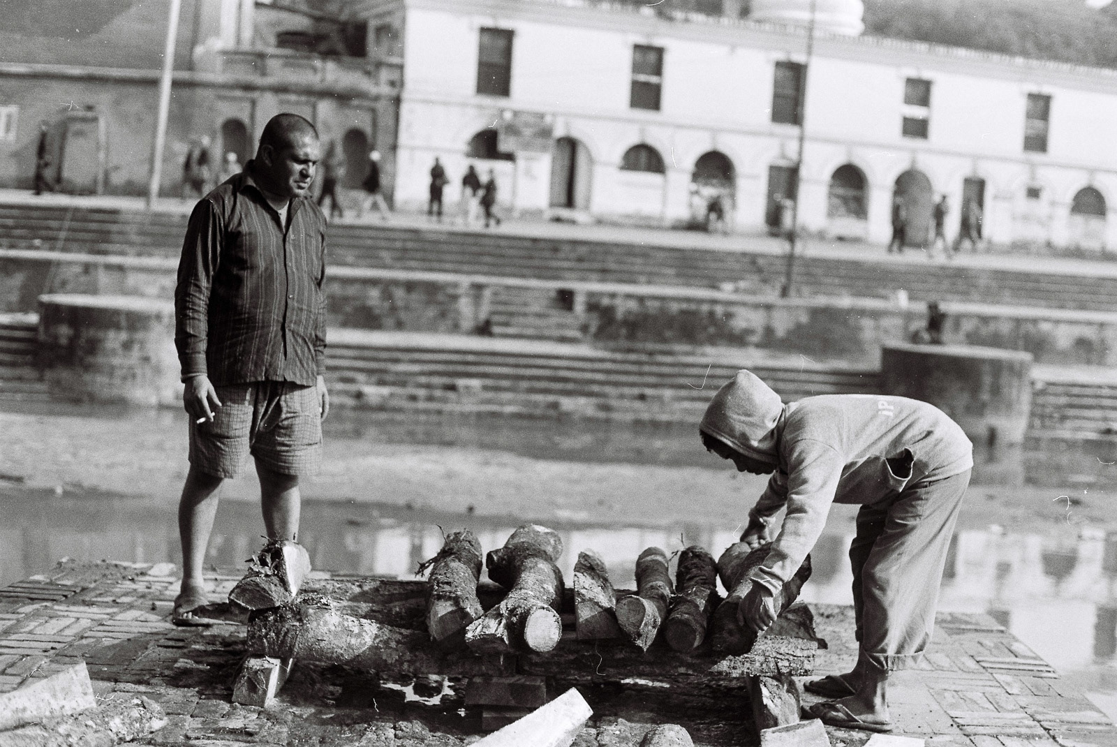 Gathering firewood for the burial ceremony.