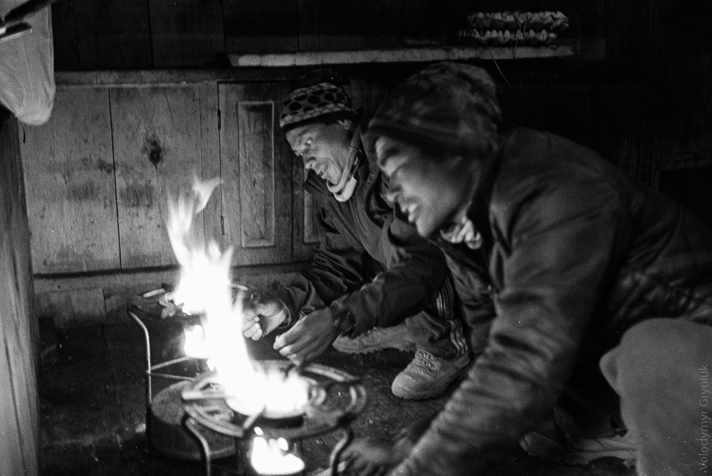Porters prepare dinner for mountain expedition members.