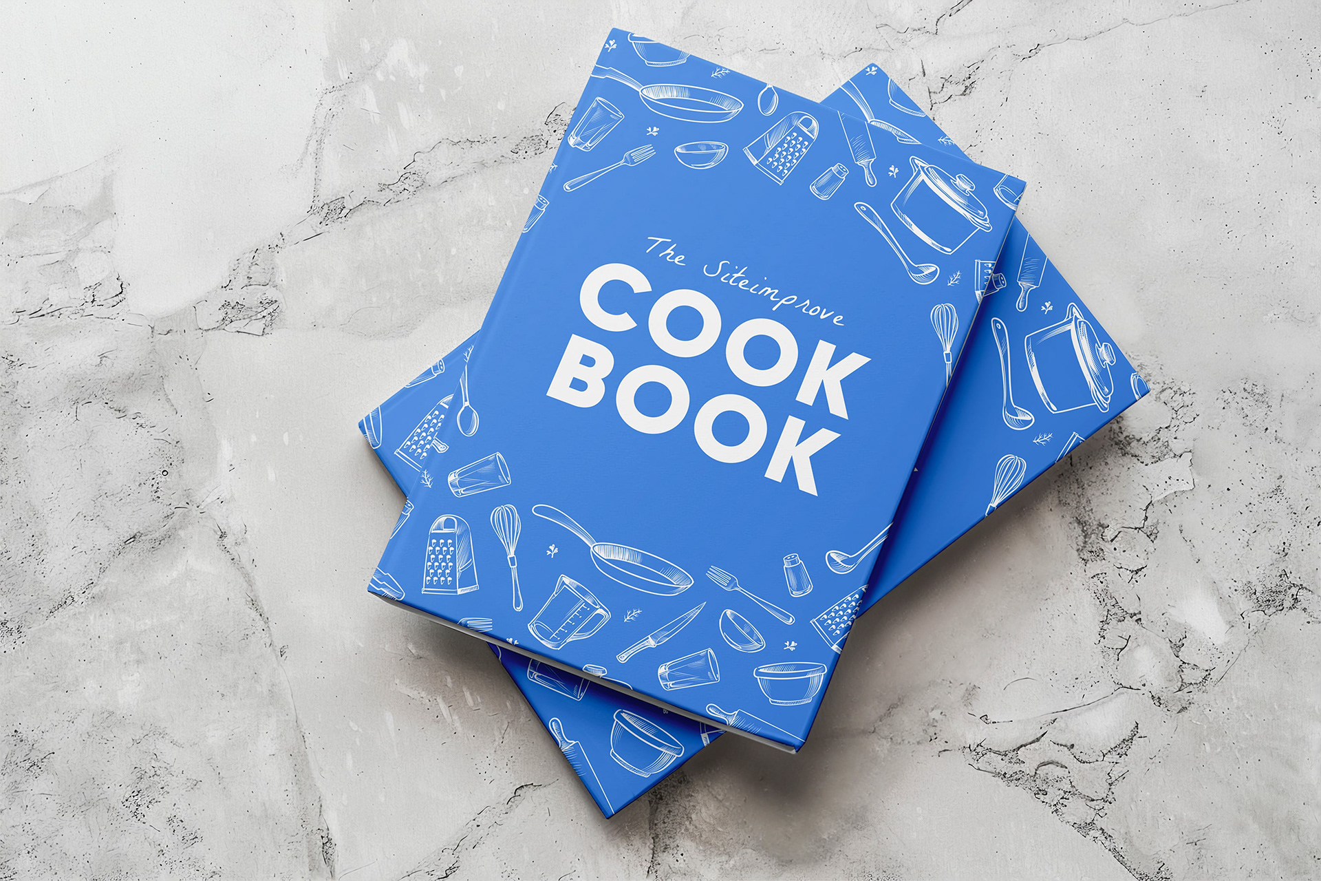 Two cookbooks on a marble surface