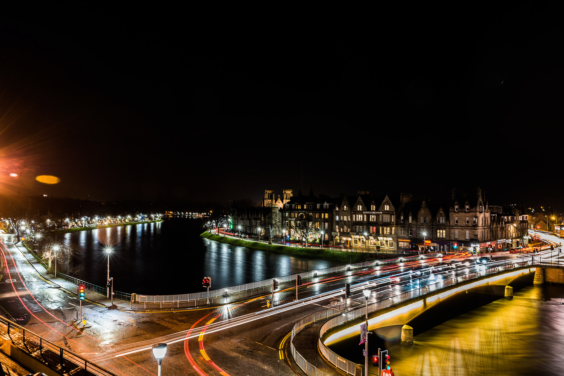 A long exposure image of traffic light-trails crossing the Ness Bridge in Inverness