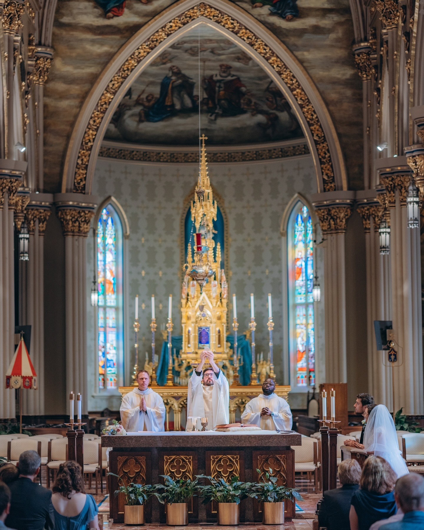 The consecration taking place at a Catholic wedding mass