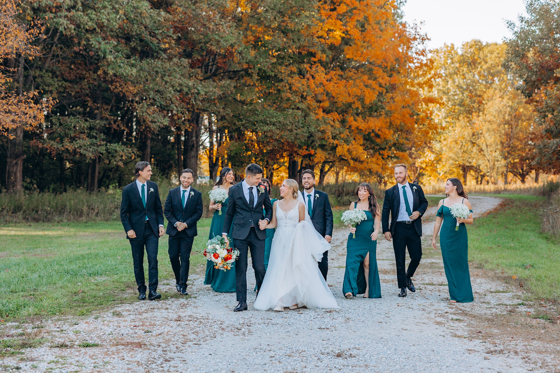 bridal party surrounds bride and groom