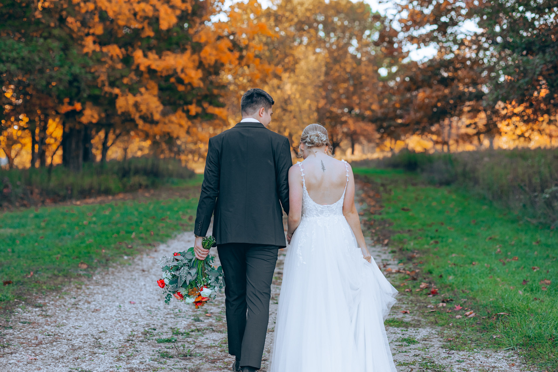 bride and groom portrait on a walk in a park
