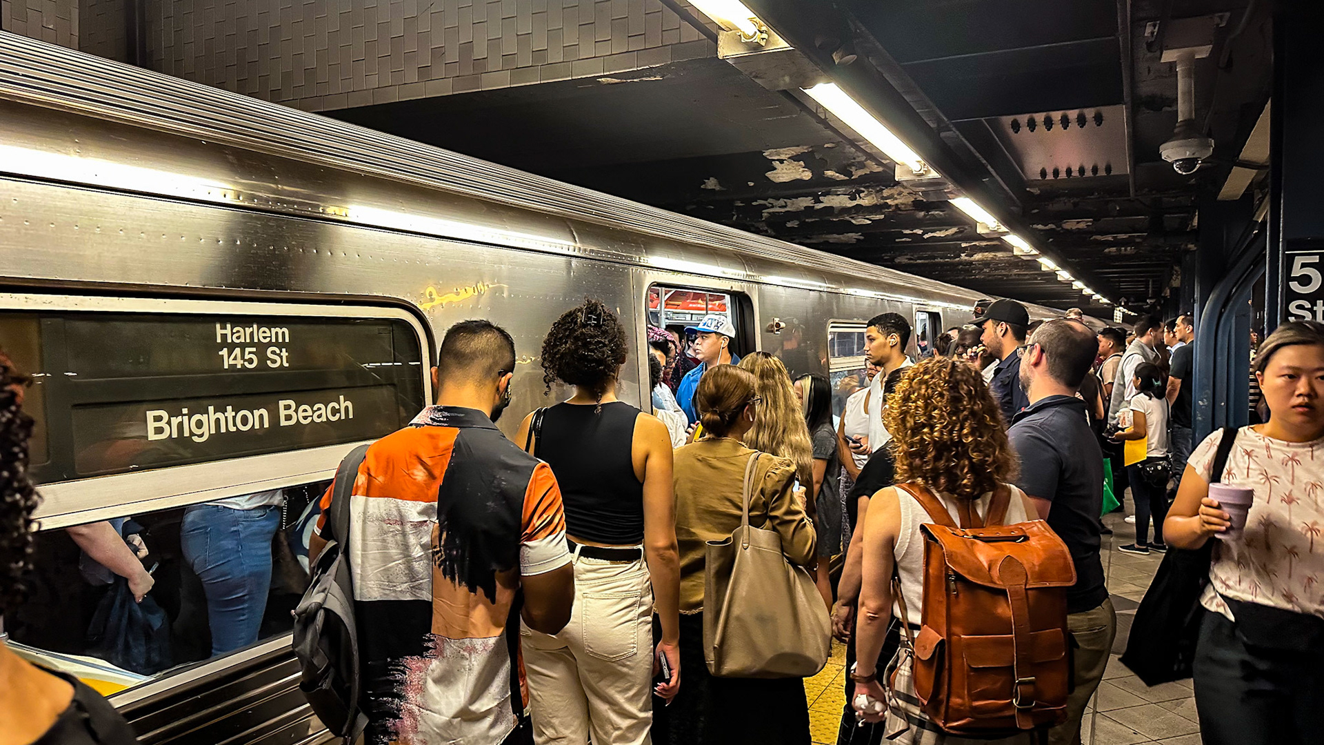 New York, NY, US - Sep 7, 2023: Passengers waiting to board crowded train at Columbus Circle