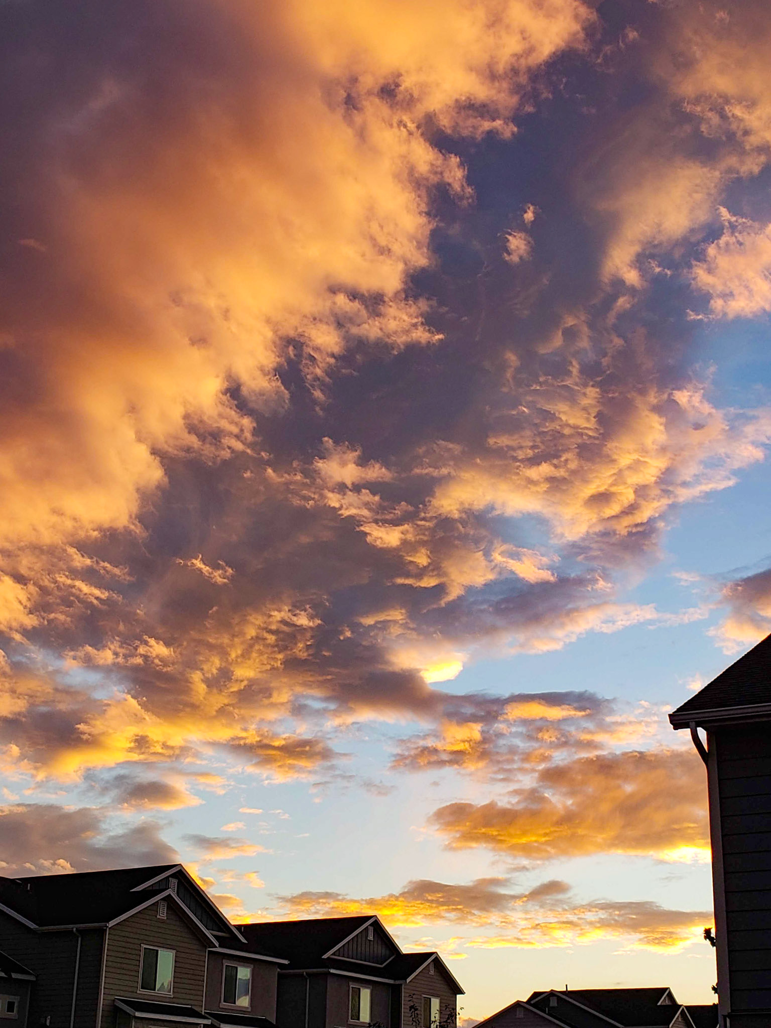 Vineyard, UT, US - Oct 8, 2018: Dramatic sunset clouds over new housing development