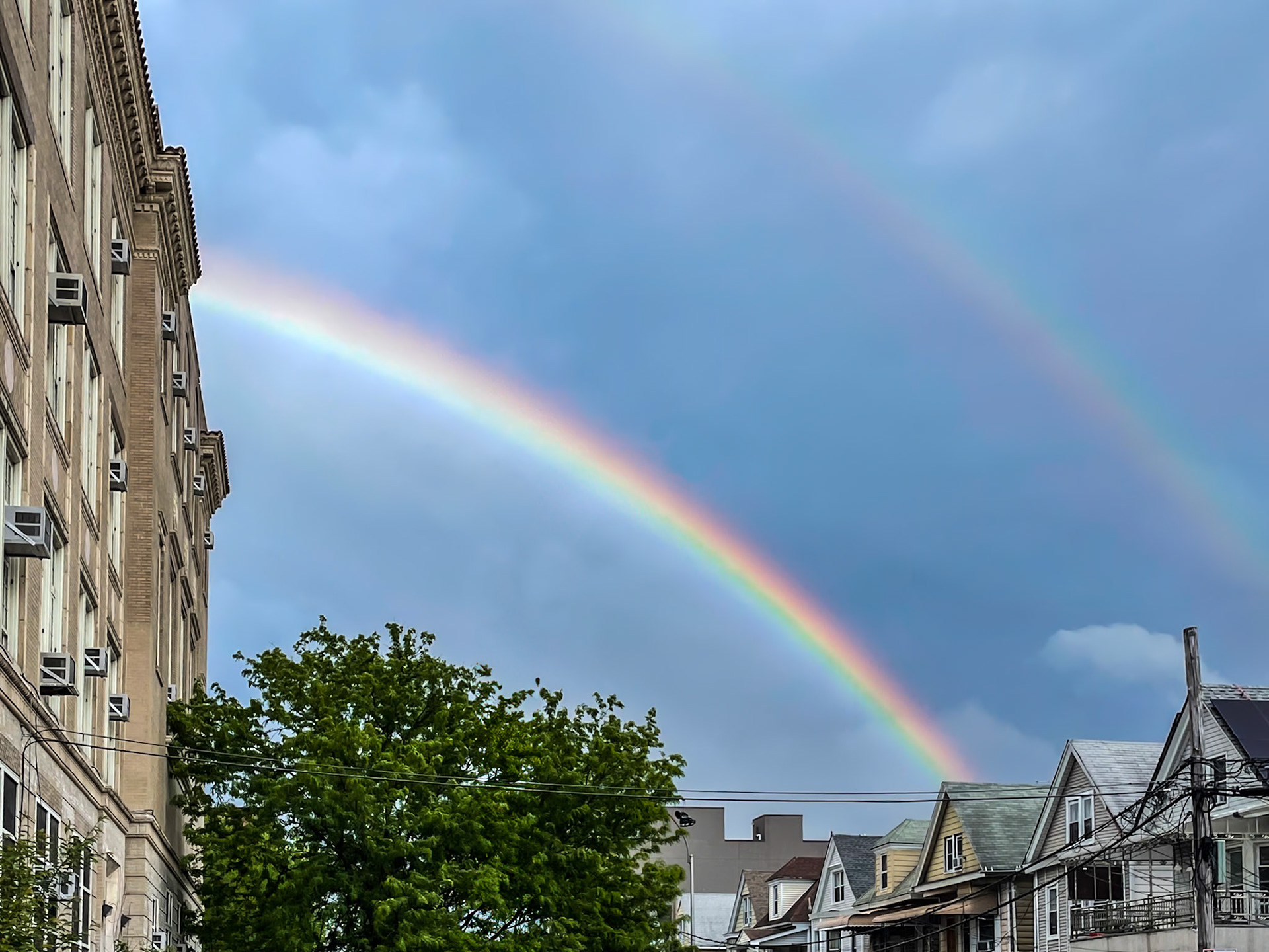 Bronx, NY, US - May 16, 2022: Double rainbow over Bronx neighborhood