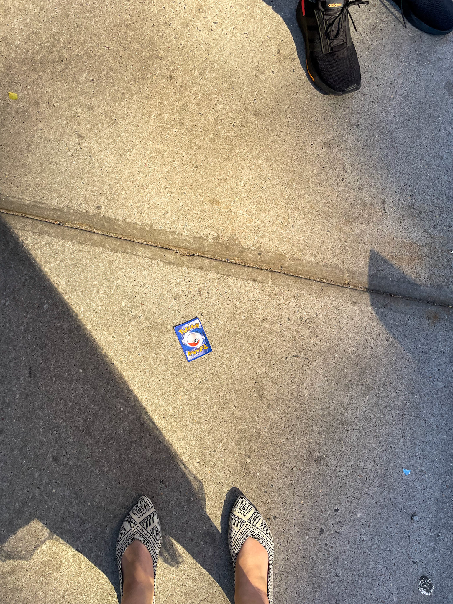 New York, NY - Jun 19, 2022: Pokemon card on the sidewalk
