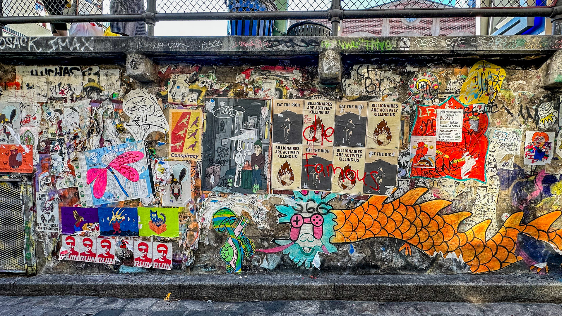Seattle, WA, US - Aug 9, 2023: Wall covered with posters and graffiti