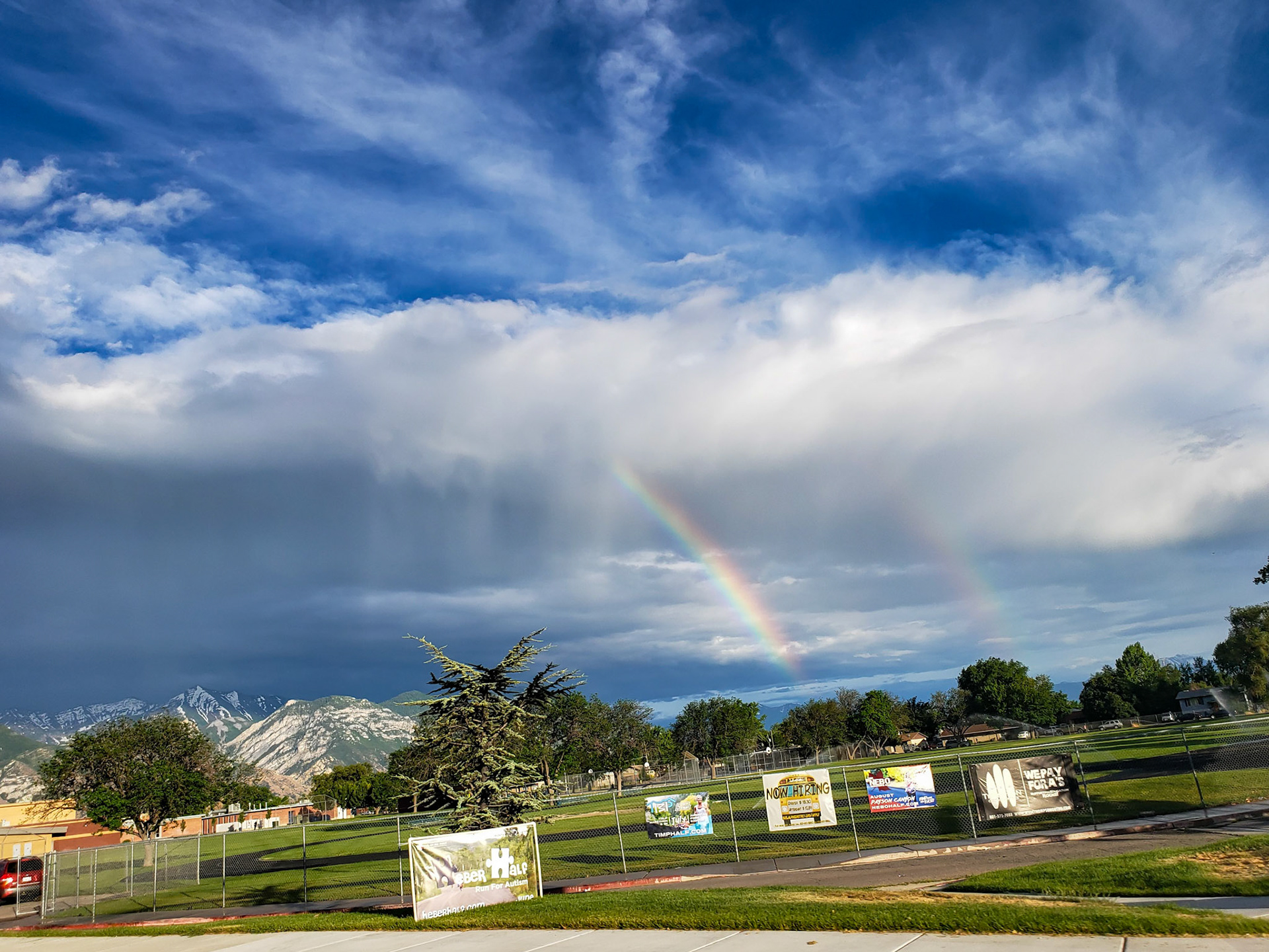 Orem, UT, US - Jun 30, 2019: Double rainbow with clouds