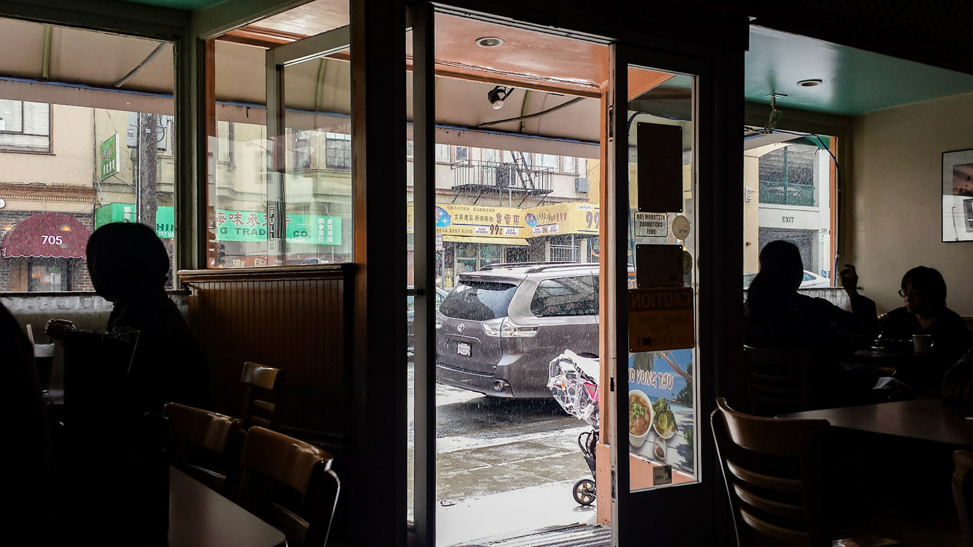 San Francisco, CA, US - Mar 11, 2016: Vallejo St in the rain seen from inside a pho restaurant