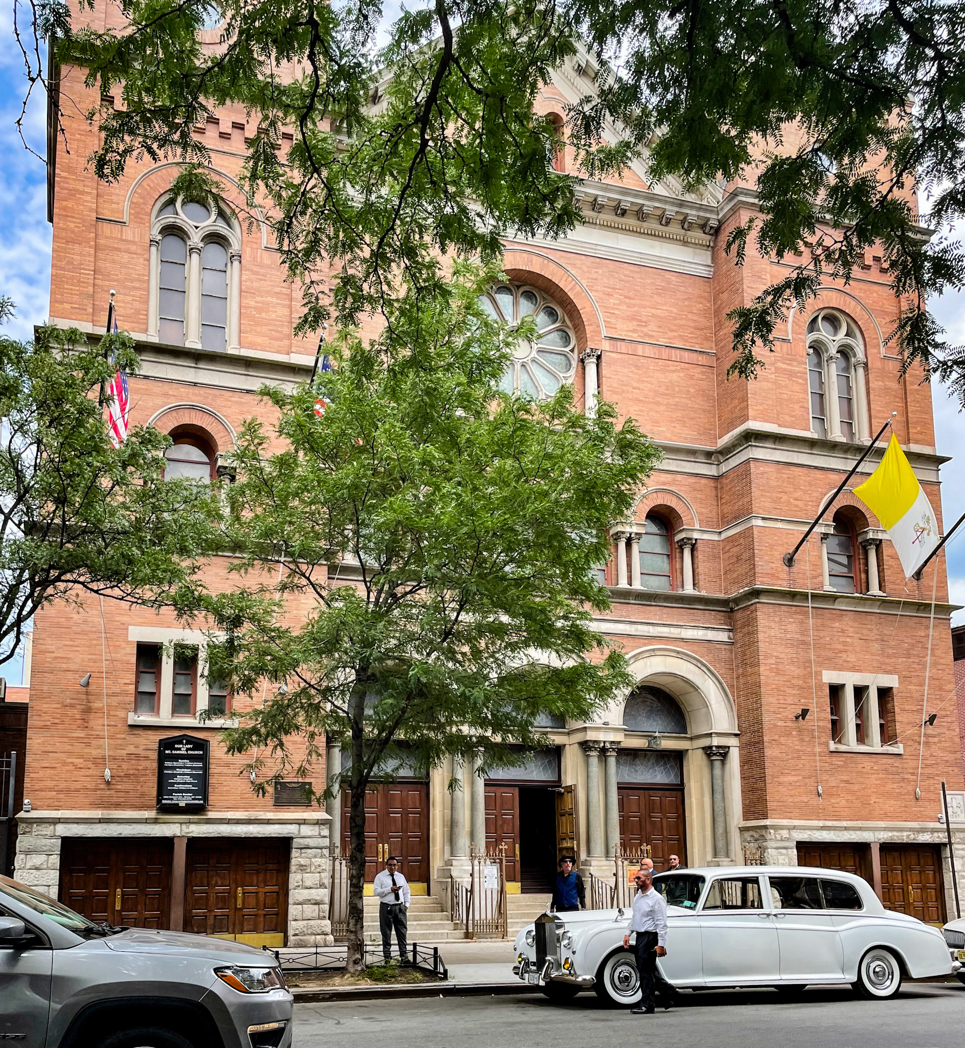 Bronx, NY, US - Jul 2, 2022: Classic car outside Our Lady of Mount Carmel Church