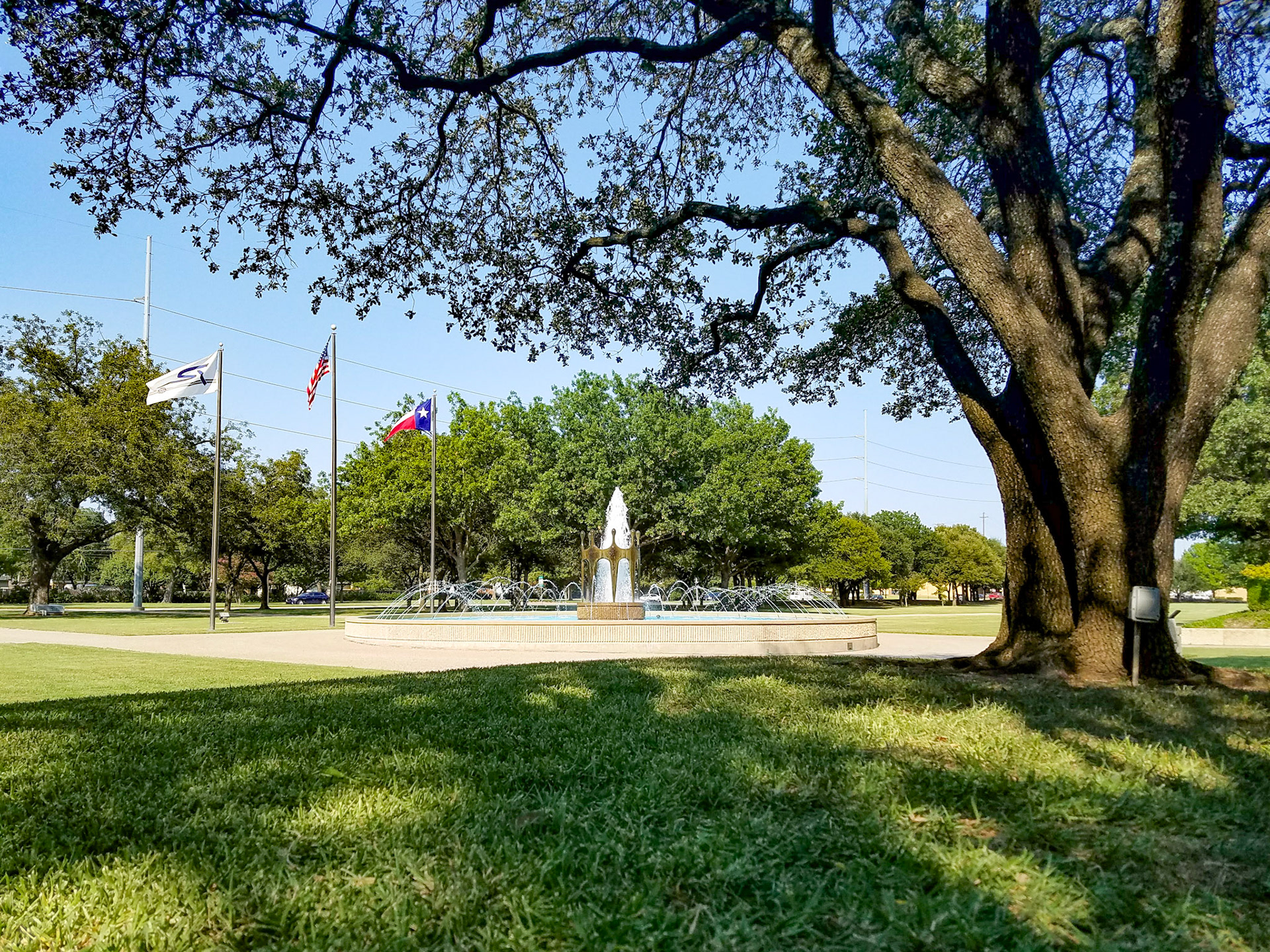 Richardson, TX, US - Sep 9, 2017: Fountain and flags outside the public library