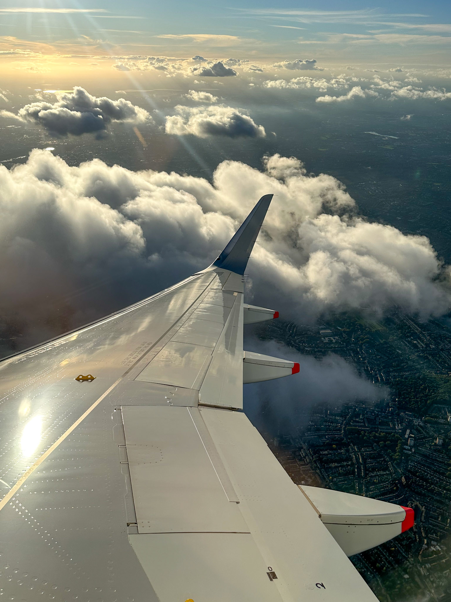 Clouds under the wing over London