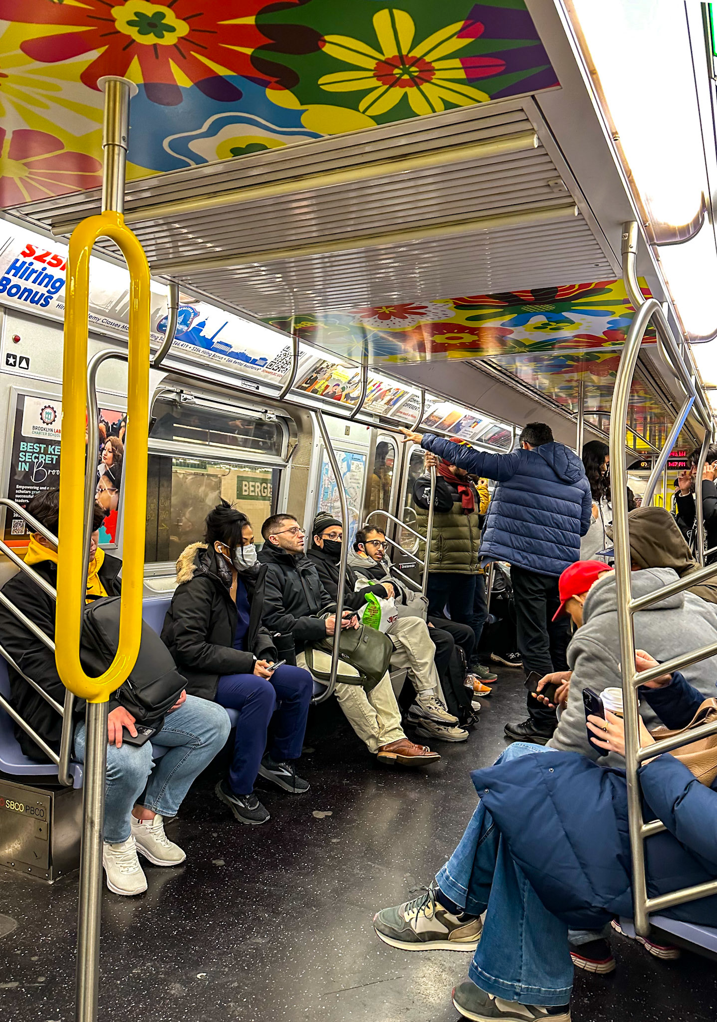 Brooklyn, NY, US - Dec 20, 2023: Interior of subway car with floral decorated ceiling