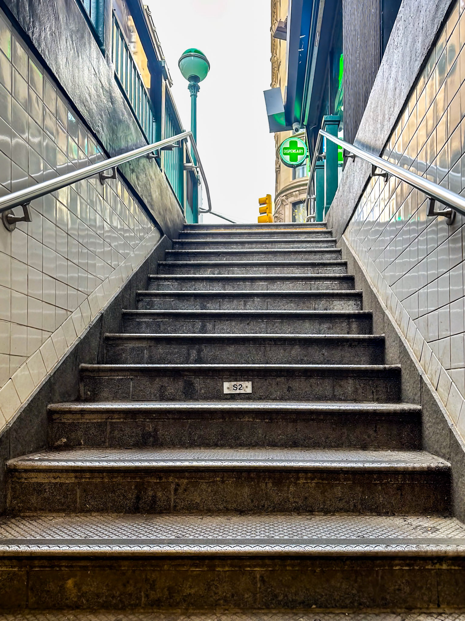 New York, NY, US - May 3, 2024: Looking up subway stairs at 28th St station
