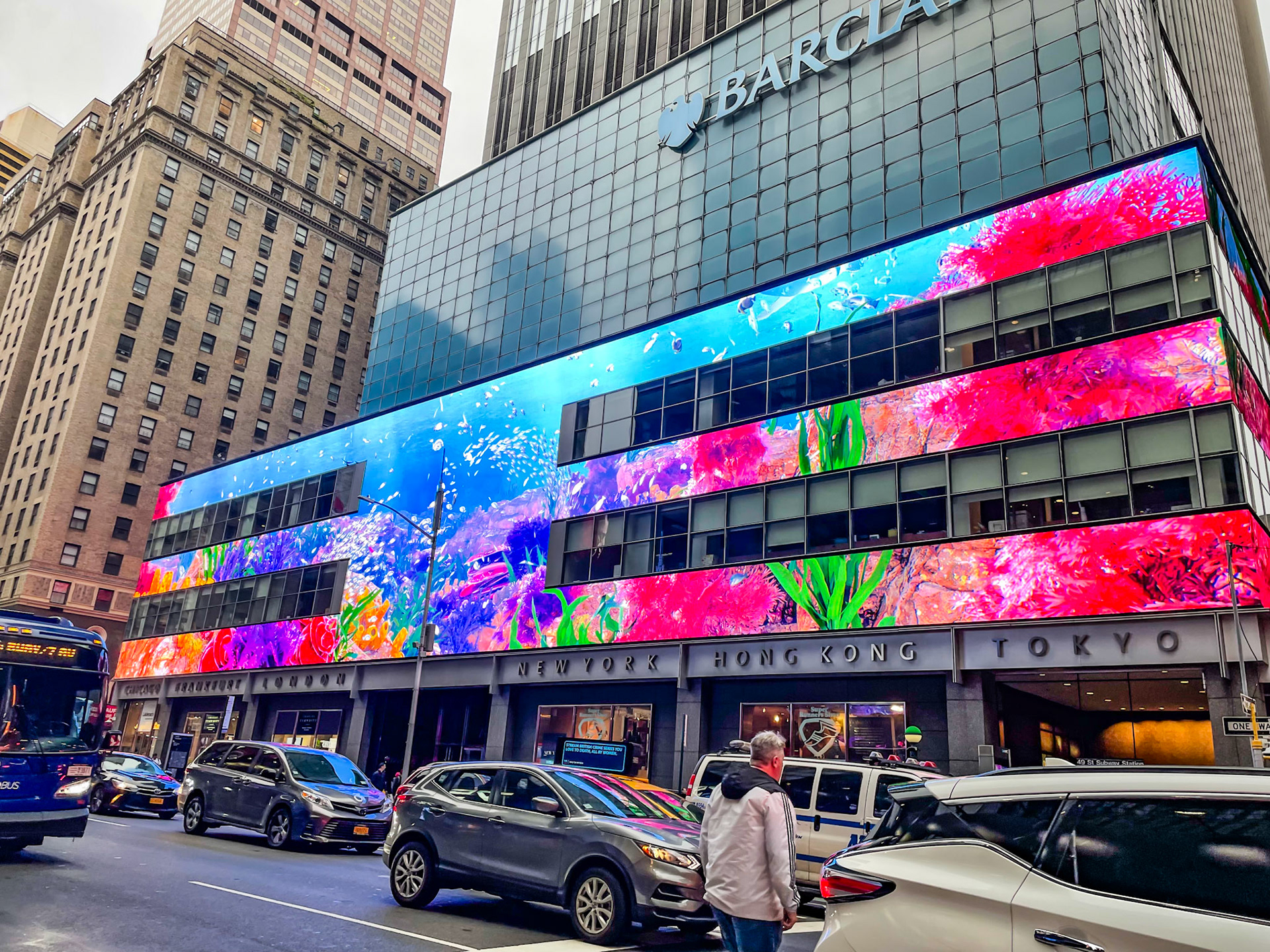 New York, NY, US - Oct 1, 2022: Seventh Ave street scene with Executive Plaza Hotel and colorful digital display on Barclays building