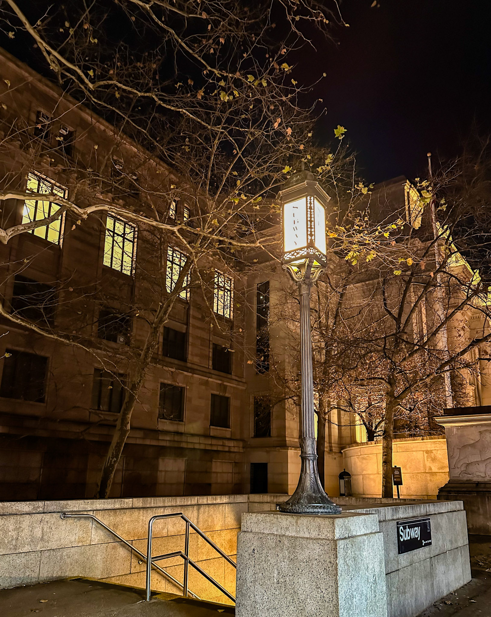 New York, NY, US - Dec 12, 2023: 81 St-Museum of Natural History subway entrance in front of museum at night