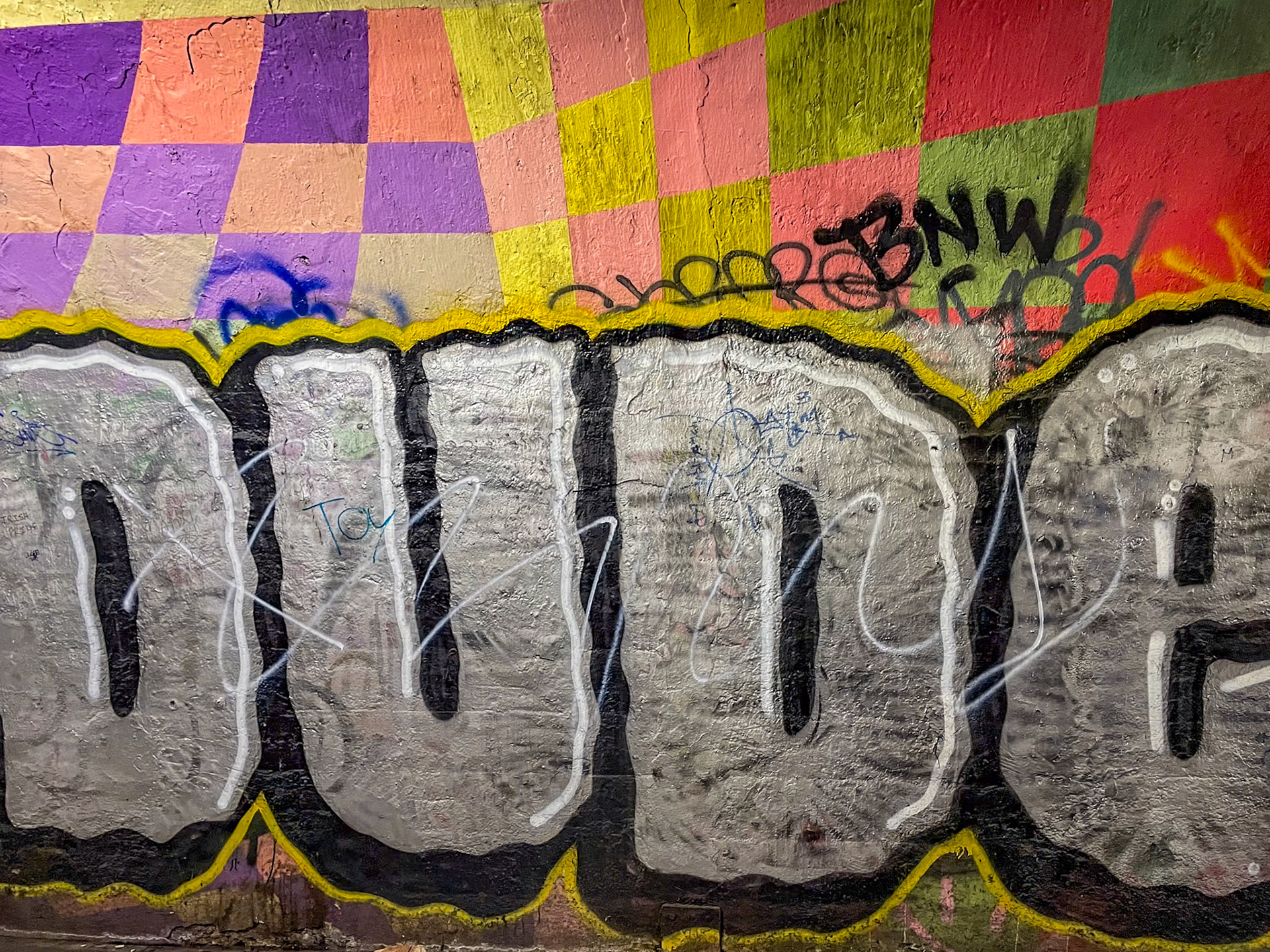New York, NY - May 29, 2022: Full color graffiti 191 St Station tunnel