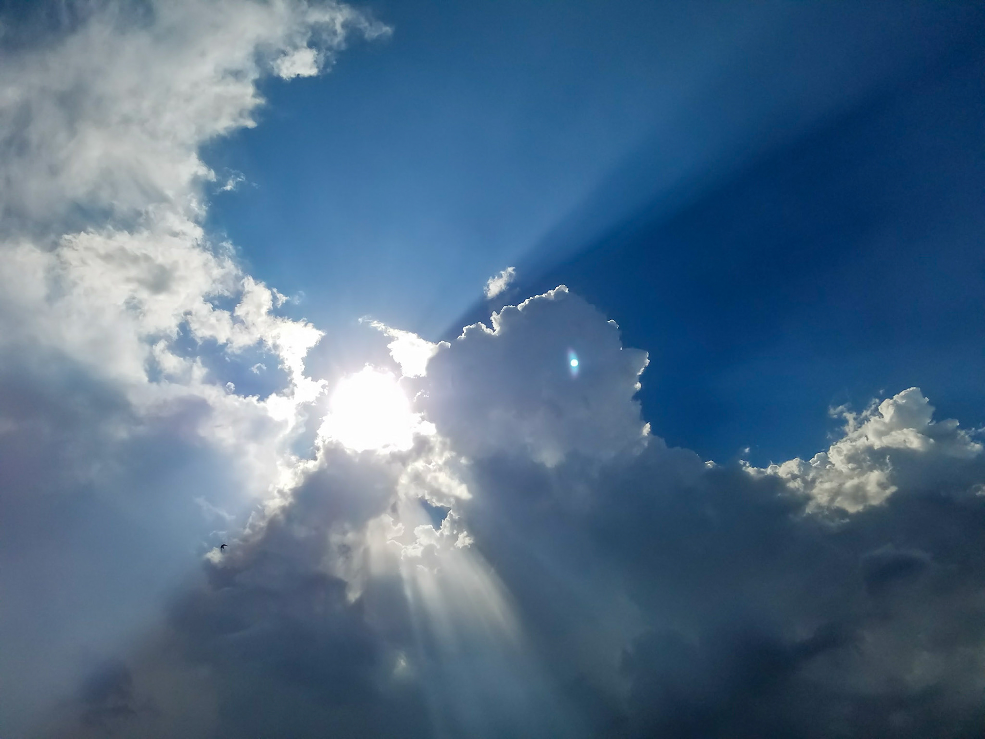 Richardson, TX, US - Aug 7, 2017: Sun shining through clouds