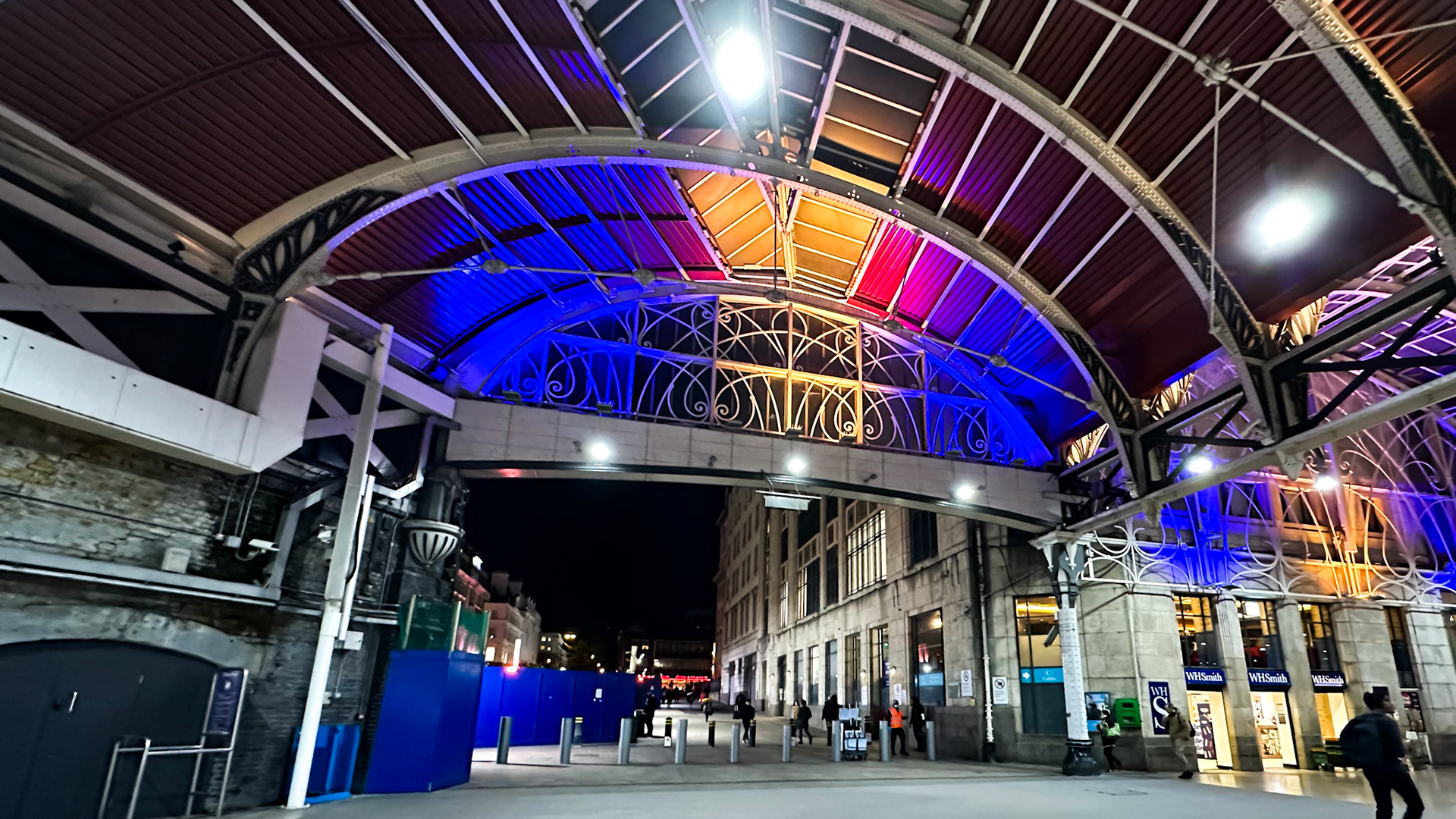 Paddington, London, UK - Apr 13, 2023: Colorful lights at Paddington station exit at night