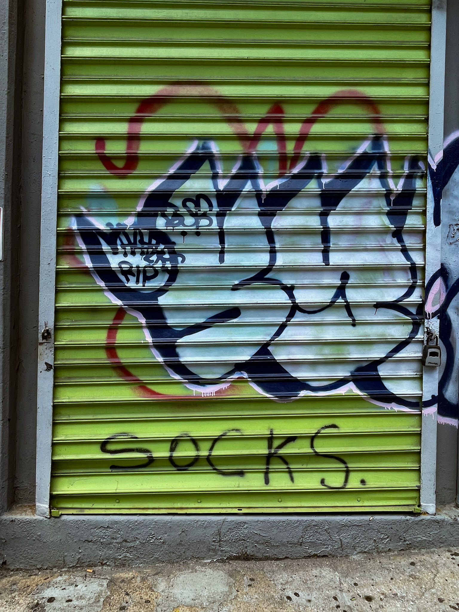 Bronx, NY, US - Jul 2, 2022: Graffiti on metal shutter door