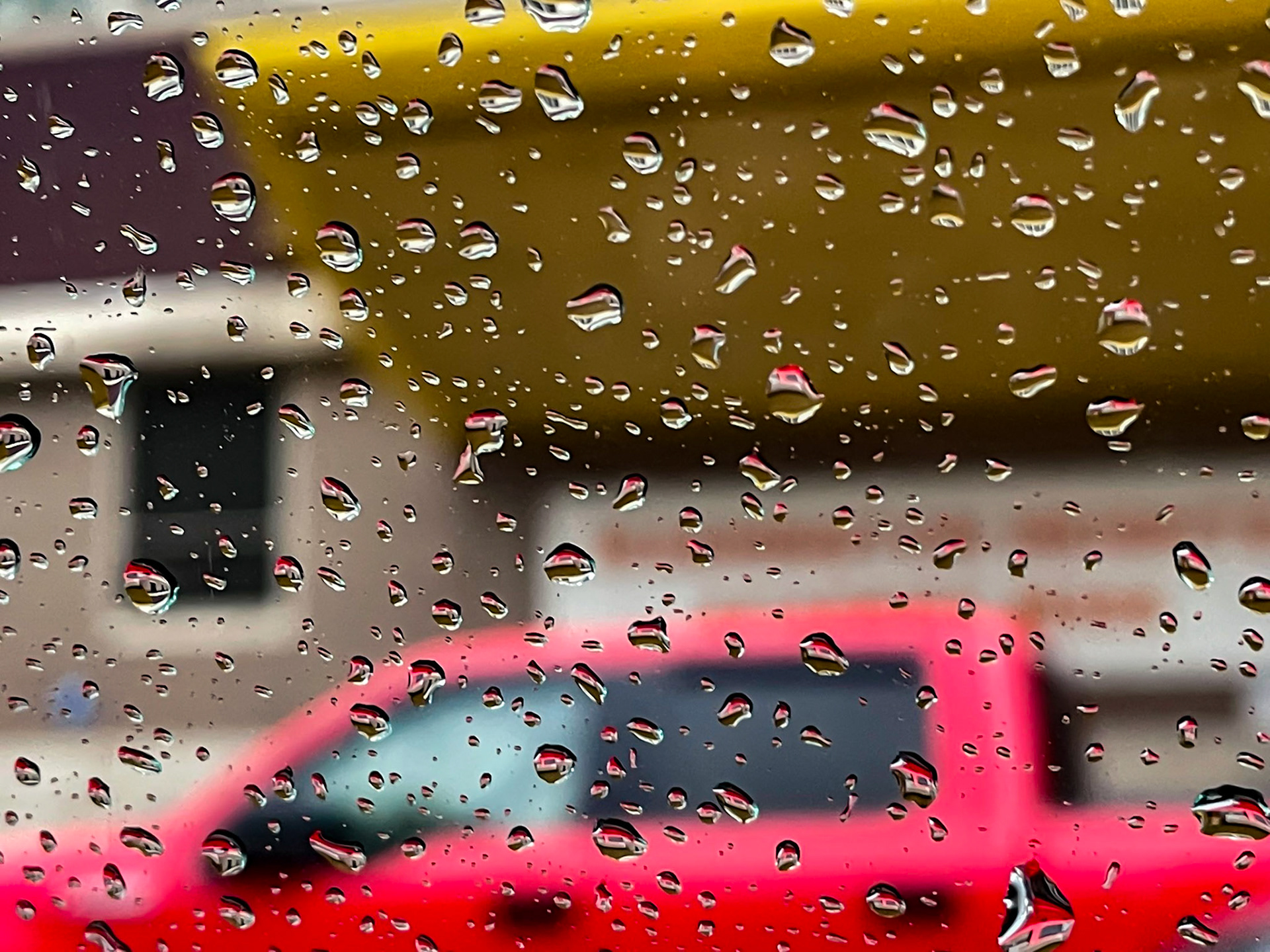 Bronx, NY, US - May 20, 2022: Raindrops on window glass