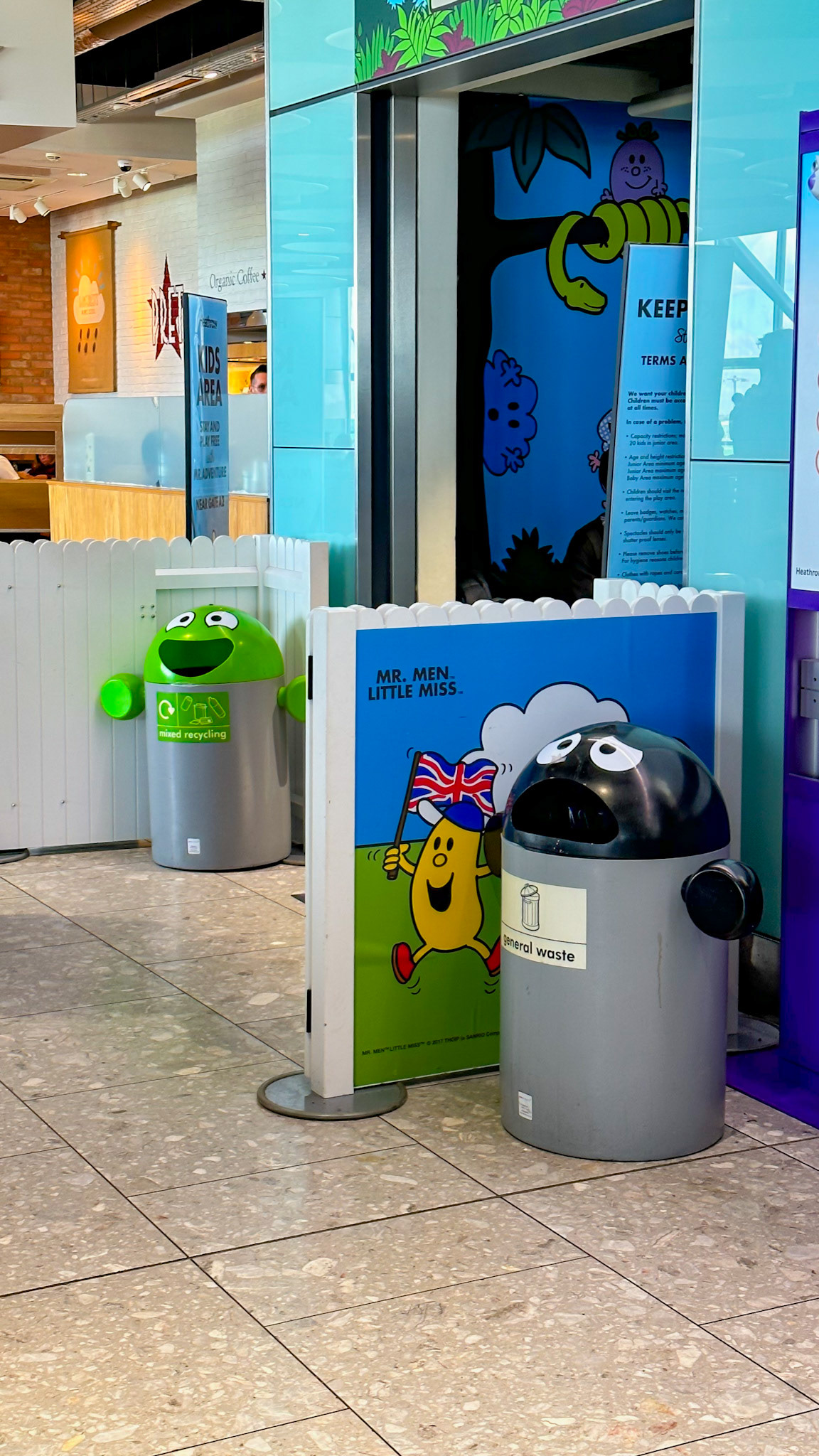 London, UK - Apr 7, 2023: Cute trash bins outside children's area at Heathrow airport