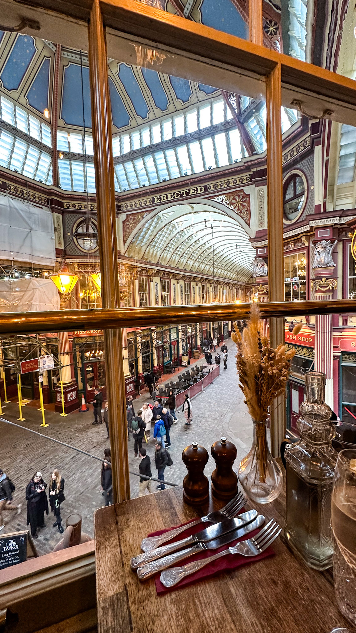 Square Mile, London, UK - Apr 14, 2023: Leadenhall Market interior seen from upper level of Lamb Tavern