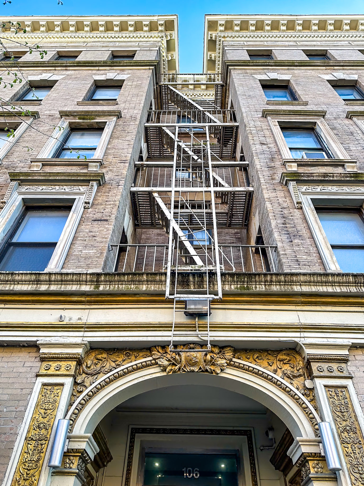 New York, NY, US - Apr 16, 2024: Upper West Side building entrance and fire escape