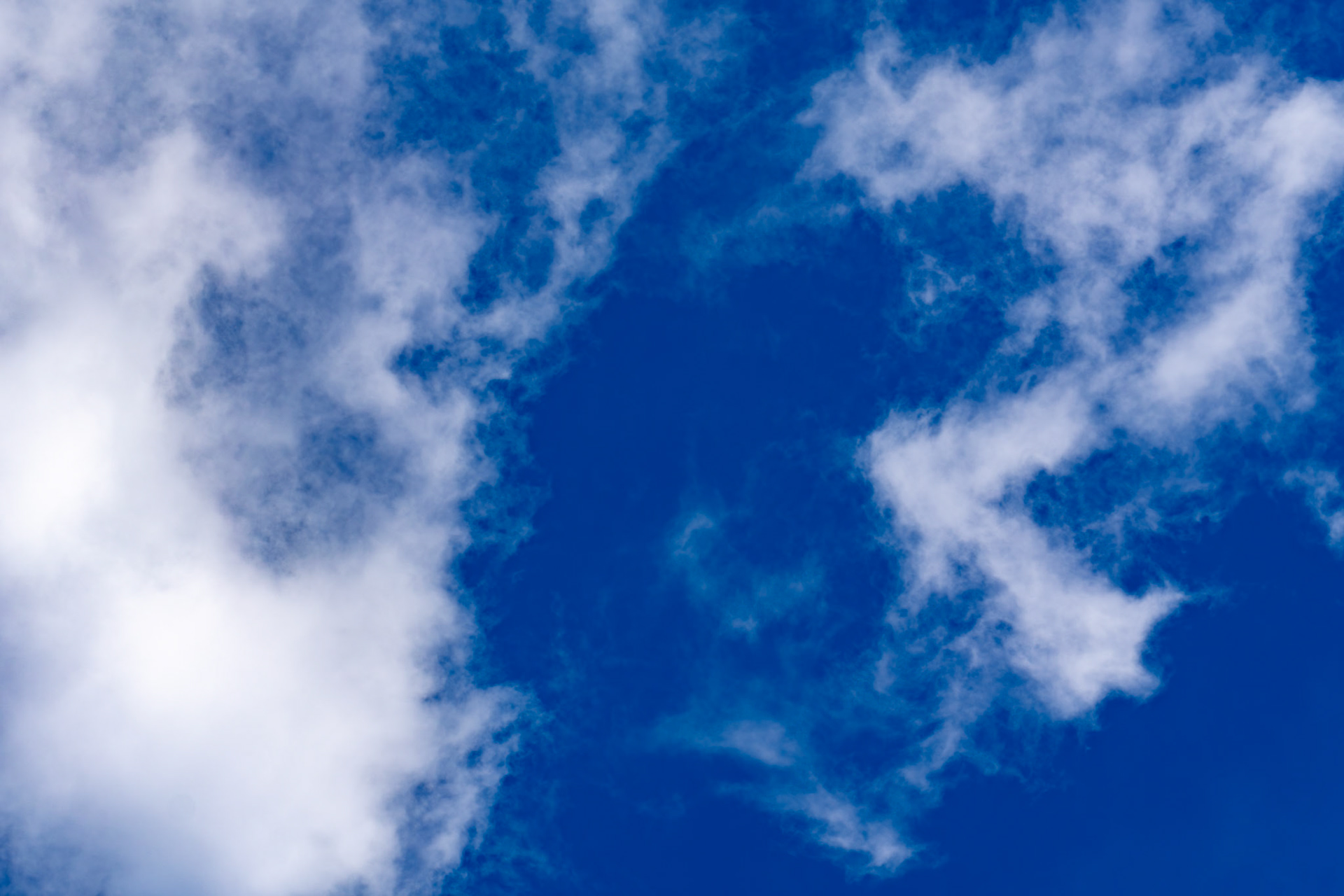 New York, NY, US - May 11, 2024: Bright blue sky with white cumulus clouds